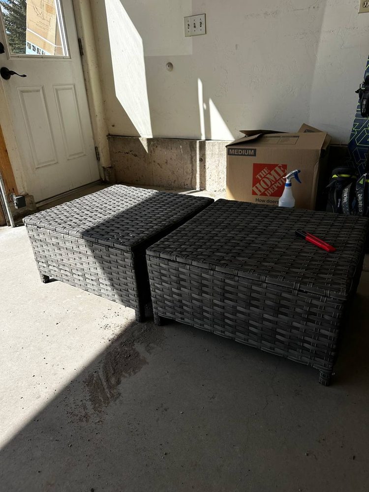 Two assembled woven storage benches standing finished in a garage — furniture assembly service in Denver