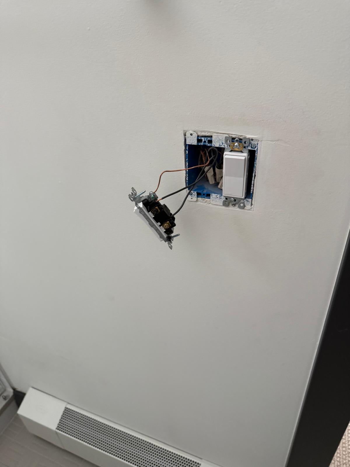 Switch box opened up with the new switch wired in before the plate goes on — electrical fixture installation service in Denver